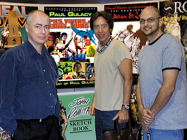 Vanguard publisher J. David Spurlock, Catwoman, Batman, 007 & Master of Kung Fu artist Paul Gulacy and designer Michael Kronenberg at the Vanguard booth, San Diego 2004, in support of the upcoming Vanguard book, Spies, Vixens & Masters of Kung Fu: The Art of Paul Gulacy